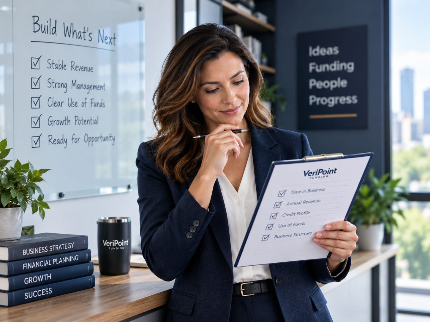 Established business owner reviewing business funding eligibility information at a laptop