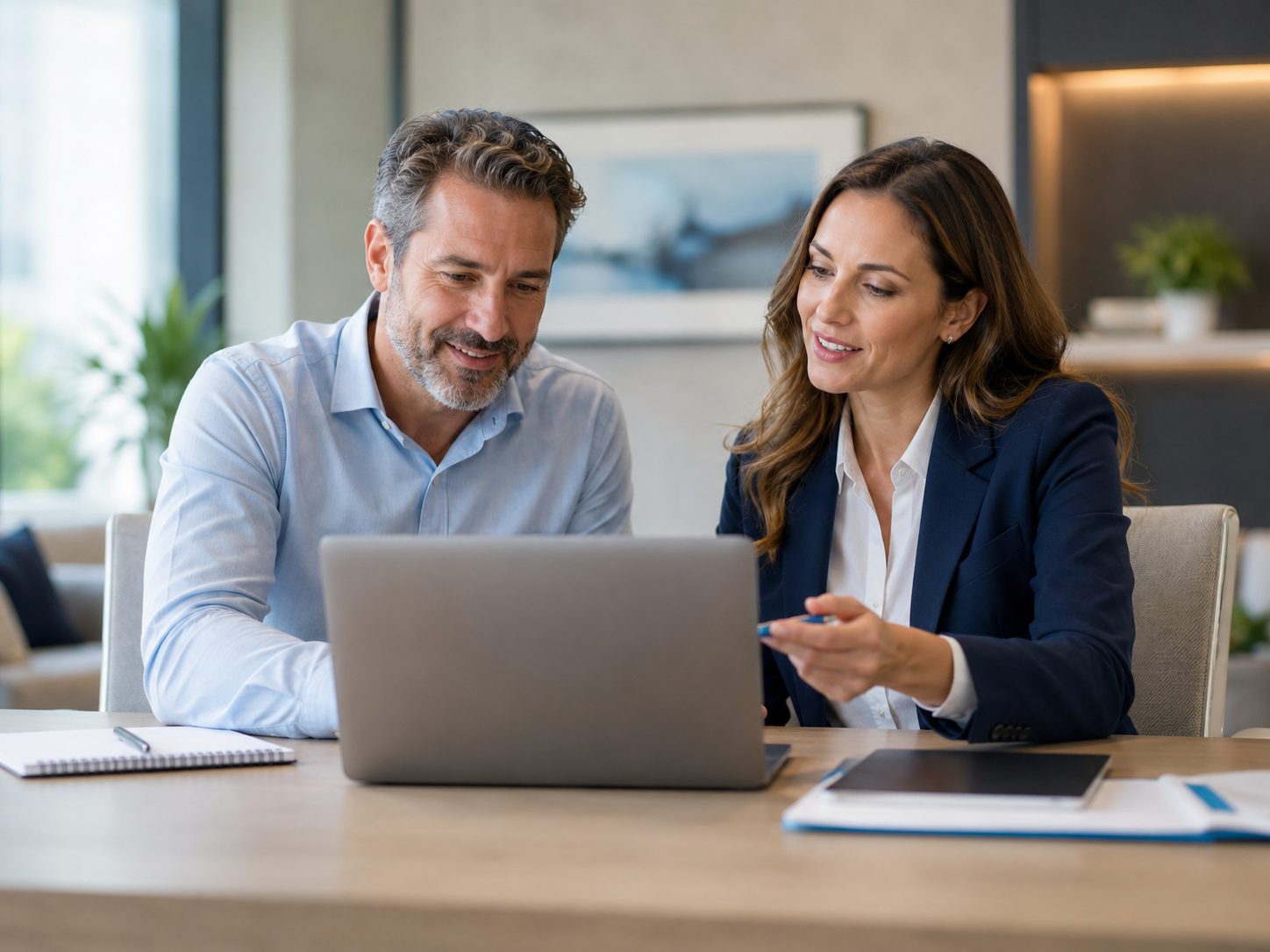 Business owner working at a laptop in an established workplace